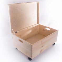 an open wooden box sitting on top of a dolly