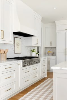 the kitchen is clean and ready for us to use it's white cabinetry