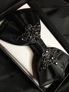 Black satin bow tie with adjustable strap. So amazing! Much better than a regular boring bow tie. Black Bow With Tie Back As Gift, Satin Bow Ties For Parties, Party Satin Ties With Decorative Bow, Elegant Black Bow Tie, Adjustable Black Bow For Black Tie Events, Adjustable Satin Bow Tie For Parties, Elegant Bow For Black Tie Events, Satin Bow Ties For Party, Adjustable Decorative Bow Tie For Party