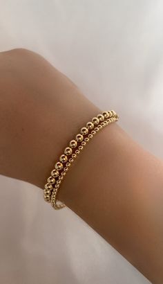 Handmade 14k Gold filled bracelets, perfect everyday wear or special occasions and a wonderful  Gift for Mom, Wife, Friend, Sister, Grandmother and Daughter. HOW TO ORDER 1. First, select your desired metal in the drop down box 1. Then, select your bracelet size and add to cart! BRACELET MEASURING GUIDE: Average Women's Sizing: 5-6.5 inches = extra small 6.5-7 inches = small 7-8 inches = medium 8 inches+ = large *We recommend ordering a size that is roughly 1/2 inch - 1 inch larger than one's ac Dainty Gold Bracelet With Round Beads For Everyday, Dainty Stackable Round Bead Bracelets, Dainty Stackable Bracelets With Round Beads, Classic 14k Gold Beaded Bracelets For Everyday, Yellow Gold Bracelets With Gold Beads For Everyday, Classic Everyday 14k Gold Beaded Bracelets, Everyday Yellow Gold Bracelets With Gold Beads, Everyday Classic 14k Gold Beaded Bracelets, Elegant Gold Bracelet With Hypoallergenic Round Beads