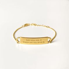 Closeup of our gold quote bracelet, engraved with the words: You will see it when you believe it. Quote Bracelet, Bracelet Quotes, Personal Narrative, When You Believe, Jewelry Quotes, Gold Engraving, Engraved Bracelet, Gold Plated Silver, People Around The World