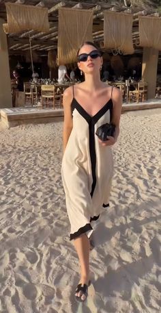 Zurie Maxi Dress Chic Beige Sleeveless Beach Dress, Chic V-neck Sundress For Summer Outings, Chic Sleeveless Beige Beach Dress, Elegant Midi Dress For Beach Vacation, Elegant Midi Dress For Beach Season Vacation, Elegant Beach Season Midi Dress For Vacation, Elegant V-neck Sundress For Summer, Elegant Maxi Dress For Poolside, Chic Summer Midi Dress For Poolside