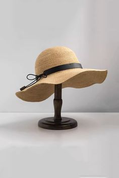 Elegant and Functional Summer Hat This packable floppy straw hat is made from 100% raffia, offering flexibility and breathability. The wide brim ensures full face sun protection, and the hat can be easily folded for travel. A chic bow adds a touch of elegance, making it perfect for any summer outing. Style #: WWAJ532 Lightweight Wide Brim Straw Hat In Toquilla, Lightweight Toquilla Straw Hat With Wide Brim, Lightweight Wide Brim Toquilla Straw Hat, Lightweight Coastal Straw Hat With Wide Brim, Lightweight Wide Brim Coastal Straw Hat, Packable Wide Brim Straw Hat, Coastal Lightweight Wide Brim Straw Hat, Coastal Style Lightweight Wide Brim Straw Hat, Toquilla Straw Hat For Outdoor