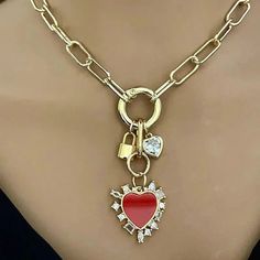 A beautiful 14k gold plated over brass, open link, Paperclip chain necklace . The chain holds 3 stunning Charms which are attached to a gold spring ring clasp. Charms- 1. A large red enamel and cubic zirconia enamel heart pendant. 2.A large heart shaped cubic Zirconia stone charm. 3.Gold padlock charm Wear alone or layer with other necklaces to change up the look. Perfect layering necklace. Tips to keep your jewelry looking good. 1) Keep jewelry away from water and chemicals. 2) Remove during ph Clean Packaging, Paperclip Chain Necklace, Large Heart, Stone Gold, Layering Necklace, Stone Heart, Keep Jewelry, Box Gift, Physical Activities