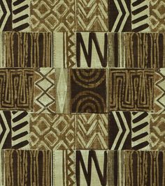 a brown and white area rug with different designs on it