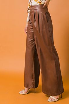 Add effortless style to your wardrobe with these Matched Energy Leather Pants. Crafted with a faux leather fabric, they feature a wide waistband with hook & eye and zipper closure, plus a pleated front detail. These pants are the perfect addition to any night-time look. Details Self: Backing: 100% Polyester Coating: 100% Polyurethane Size & Fit - Model is 5`8" And Wearing Size Small - Measurements Taken From Size Small - Approx. Length: 45" Fall Closet, Longline Cardigan, Leather Pant, Wide Waist, Faux Leather Fabric, Faux Leather Pants, Hook Eye, Wide Waistband, Body Suit