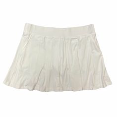 a white skirt with pleaing on the bottom