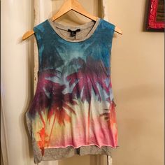 Forever 21 Palm Tree Muscle Tee. Brand New, With Tags! High Neck, Sleeveless. Grey Back, Blue, Pink, Yellow, Orange, Purple On Front. Perfect For Beach, Pool, Vacation, Festival Wear! Follow And Share! Trendy Multicolor Print T-shirt For Summer, Trendy Summer Tank T-shirt, Multicolor Crew Neck Top For Vacation, Casual Cotton Tops With Palm Tree Print, Trendy Multicolor Summer Tops, Trendy Rainbow Print T-shirt For Summer, Multicolor Rainbow Print Graphic Tee, Casual Cotton Top With Palm Tree Print, Trendy Multicolor Print Sleeveless Top