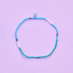 Dive into the beauty of the ocean with our Seafoam Dream Stretch Anklet – the ultimate summer accessory! Inspired by the serene hues of the sea, this anklet features a mesmerizing blend of light blues and teals, reminiscent of tranquil ocean waves. String on durable nylon cord that adjusts and stretches to any size Length of anklet is 9" Because jewelry products are handcrafted by artisans, dimensions may vary from piece to piece Tiny Beads Bracelets For Summer Beach, Summer Beach Bracelets With Tiny Beads, Turquoise Summer Friendship Bracelet With Tiny Beads, Turquoise Friendship Bracelets With Tiny Beads For Summer, Summer Friendship Bracelets With Tiny Turquoise Beads, Turquoise Friendship Bracelet With Tiny Beads, Ocean-inspired Beaded Anklets For Summer, Blue Bracelets For Summer Beach, Blue Bohemian Friendship Bracelets For Summer