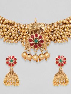 Gold-Toned & Plated 24K Handcrafted Ruby Ghungroo Temple Choker SetMaterial With Stone Type: Copper WIth Artificial StonesPlated: Gold-PlatingClosure: Drawstring ClosureA pair of Gold & Red Ghungroo Drop Earrings has post & back closure Size & Fit Size: Necklace: 24 cm; Earrings: 4.1 cm Material & Care Material: BrassPlating: Gold-PlatedClosure: DrawstringCare Instructions: Wipe your jewelry with a soft cloth after every use Always store your jewellery in a flat box to avoid accidental scratches Temple Motifs, Ethnic Kurti, Choker Jewellery, Anarkali Lehenga, Jewelry Cleaning, Choker Gold, Jewelry Cleaning Solution, Wedding Jumpsuit, Ready To Wear Saree