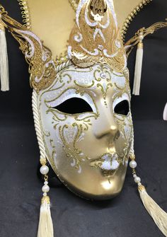 Venetian Mask for decoration - Traditional and original papier-mache Venetian mask, handmade and decorated with metal insert, gold-leaf and glitters,enriched with Swarovski crystals. dimensions::Hight 43cm,width 27cm Decorations only,Not wereable All our masks are handmade papier-machè masks made in Venice. Our decorators use techniques typical of the Venetian tradition such as stucco, acrylics, gold and silver-leaf, macramè, passementerie, glitters and crequelè to offer you a wide range of orig Venetian Masks For Mardi Gras Carnival, Mardi Gras Masks And Prosthetics, Venetian Masks For Mardi Gras, Venetian Masks For Mardi Gras Gift, Venetian Masks And Prosthetics For Carnival, Venetian Masks For Carnival Themed Events, Venetian Masks For Themed Carnival Events, Venetian Mask For Mardi Gras Costume, Venetian Masks And Prosthetics For Mardi Gras