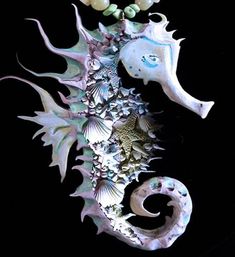 a sea horse with pearls on it's neck