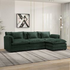 a living room with a large green couch