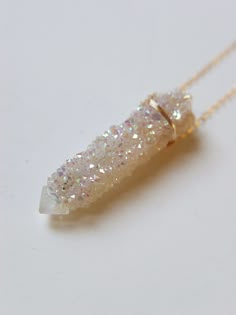 "Featuring a single beautiful Angel Aura Spirit Quartz Raw stone which was handcrafted into a 14k gold filled bezel set pendant piece. The stone has a pretty natural sparkle. This necklace highlights the beautiful elements of this arresting stone. The stone measures approx. 1.25\" long and 15mm wide. Chain is 18\" long. Handmade in my California studio This is a Limited Edition Piece Edition! Please allow for natural variation in crystals. No two are the same. They are unique just like you! Each Spirit Quartz Necklace, Angel Aura Crystal, Raw Crystal Necklace, Spirit Quartz, Aura Crystals, Angel Aura Quartz, Beautiful Angel, Color Corrector, Edgy Wallpaper