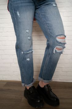 The ultimate jeans for spring! Mid rise classic Boyfriend style 100% cotton Distressing around knees Open side seam Double fold hem Model is 5'0" and wearing a size. The length measures 37" and the inseam measures 28". Fall Distressed Medium Wash Cropped Jeans, Cutoff Denim Jeans For Fall, Fall Cutoff Denim Jeans, Fall Cutoff Denim Cropped Jeans, Dark Wash Ripped Jeans For Everyday, Dark Wash Mom Fit Jeans For Spring, Spring Dark Wash Mom Fit Jeans, Fall Light Wash Cutoff Jeans, Fall Denim Blue Cutoff Jeans