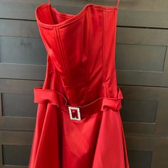 Gorgeous Strapless Red Silk Dress With Corset Like Top And Flared Skirt. Perfect For The Upcoming Holidays! Rhinestone Belt. No Tags But Never Worn. Perfect Condition. I’m 5’3” And Skirt Hits About 6” Above My Knees. Runs Small And Could Fit A Size Small. Red Strapless Dress Aesthetic, Red Silk Strapless Dress, Red Strapless Corset With Boned Bodice, Red Strapless Dress With Boning, Red Fitted Strapless Dress, Mini Length, Mermaid Midi Dress, Fitted Maternity Dress, Sax Dress, Strapless Ruffle Dress