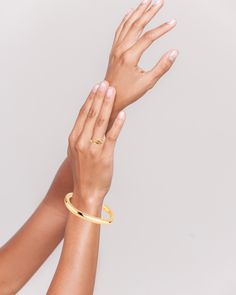 The Loretta Cuff, plated in exquisite 14k gold or silver finish, offers a minimalistic charm. Its versatility makes it a perfect complement to other bracelets. We offer resizing options to ensure the best fit. A timeless classic for your collection. View this post on Instagram A post shared by 𝔹𝕠𝕦𝕟𝕜𝕚𝕥 𝕁𝕖𝕨𝕖𝕝𝕣𝕪 (@bounkitnyc) Modern 14k Gold Bracelets For Everyday Luxury, Timeless Gold Cuff Bracelet For Wedding, Minimalist Gold Rings For Everyday Luxury, Gold Minimalist Rings For Daily Wear, Minimalist Everyday Luxury Gold Rings, Timeless Gold Cuff Bracelet With Polished Finish, Timeless Gold Cuff Bracelet, Gold-plated Polished Cuff Bracelet For Formal Occasions, Formal Gold Plated Cuff Bracelet With Polished Finish