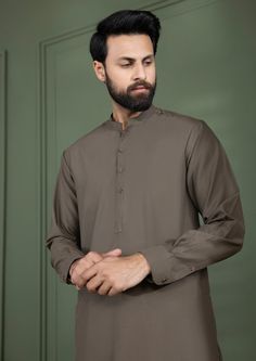 2 Piece - Kurta Shalwar : Skillfully crafted from premium cotton, this classic kurta shalwar for men is a wardrobe staple this season! Details : Plain Front, Plain Back, Band Neck Color: Rust Fabric : Wash & Wear Yarn Dyed Pin Stripes Semi-formal Long Sleeve Kurta With Dabka, Semi-formal Long Sleeve Dabka Kurta, Classic Cotton Kurta For Semi-formal Occasions, Formal Cambric Kurta, Formal Long Sleeve Cambric Kurta, Formal Cotton Salwar Kameez With Dabka Detailing, Cotton Salwar Kameez With Dabka For Formal Occasions, Classic Unstitched Kurta For Semi-formal Occasions, Cotton Sherwani With Naqshi For Eid