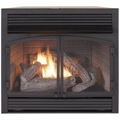 a fire place with logs burning in it