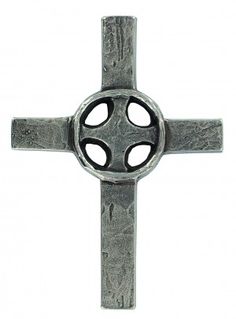 a metal cross with holes in the middle