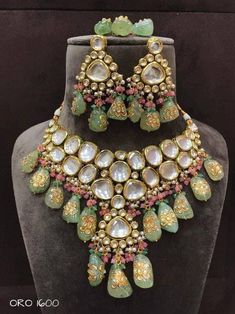 Sabyasachi Inspired Designer Kundan Set, Green Kundan Choker, Kundan Bridal Choker Set, Kundan Bridal Set Sabyasachi inspired kundan choker set with a twist of Tanjore hand-painted beads perfect for brides. Color of the tanjore beads can be custozmied Details: > Premium quality kundans used with back meenakari > Hand-painted tanjore beads in unique irregular shapes > tiny Onyx beads to enhance the beauty > Color of the tanjore & onyx can be customized. Please message us for more info. Feedback: Bridal Choker Set, Wedding Choker Necklace, Kundan Choker Set, Hand Painted Beads, Kundan Jewellery Set, Ethnic Wedding, Kundan Choker, Bridal Choker, Irregular Shapes