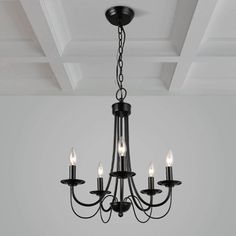 a chandelier with five lights hanging from the ceiling