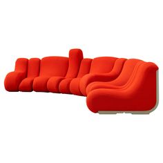 an orange couch sitting on top of a white floor next to a red chair and ottoman