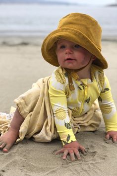 Protect your little one's tender skin and make a stylish statement with our Baby Corduroy Bucket Hat in mustard. This adorable hat provides sun protection while keeping your toddler comfortable and fashionable. Ideal for family beach days, this hat is the perfect companion on all your sunny adventures. Shop now and let your child shine! Adjustable Summer Sun Hat For Summer Adventures, Summer Sun Hat With Upf 50+ For Playtime, Playful Sun Hat With Upf 50+ For Beach, Spring Sun Hat With Upf 50+ For Playtime, Playful Upf 50+ Sun Hat For Beach, Cute Yellow Summer Sun Hat, Playful Bucket Hat With Upf 50+ For Beach, Playful Sun Hat For Beach, Playful Sun Hats For Beach