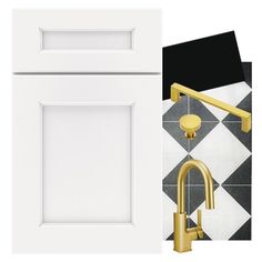 a white door with gold handles next to a black and white tile wall that has a golden faucet on it