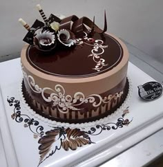 a chocolate cake sitting on top of a white counter