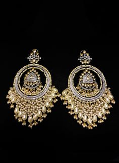 Russu - Amrapali Indian Cluster Pearl Earrings with Kundan stones Amrapalli Indian bridal earrings made with hammered metal and plated with gold. This luxurious Kundan stone stud setting makes this earring jewelry one of a kind. Gorgeous cluster pearls adorn this piece adding grace to this jewelry piece. Mini pearl drops enhance this piece making it perfect to be paired with any of your ethnic wear. Approximate earrings 3.5" Details: Handcrafted Metal: Metal Alloy, Gold Plated Stone: Kundan &amp Indian Bridal Earrings, Kundan Earrings, Hammered Metal, Stud Set, Stone Studs, Earring Jewelry, Ethnic Wear, Indian Bridal, Pearl Drop