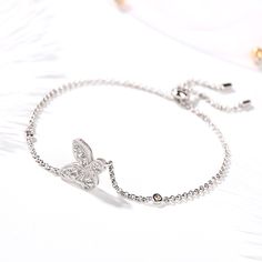 A smart choice you'll want to wear day after day, this sparkling bracelet speaks to your lovely sense of style. Crafted in sterling silver, it features a butterfly adorned with sparkling stones in varied sizes which wrapped in a frame of milgrain detailing.Besides,this bolo bracelet is easy to adjust the size to fit her wrist to create different looks. Sparkling stones add an element of glamour to this feminine design. This lovely bracelet make an elegant accessory. Weight: 4.67 gWidth: 14.97 mm Silver Bracelet With Butterfly Clasp, Elegant Silver Bracelet With Butterfly Clasp, Elegant Bracelets With Butterfly Clasp, Silver Bracelet With Butterfly Clasp For Gift, Elegant Silver Butterfly Bracelets, Silver Sterling Silver Butterfly Bracelet, Butterfly-shaped Sterling Silver Bracelet, Elegant Adjustable Bracelets With Butterfly Charm, Adjustable Silver Jewelry With Butterfly Clasp