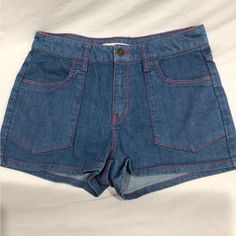 These Shorts Are Almost Vintage, About 15 Years Old. Were Washed But Never Worn. Very 70’s Hippie Style. Blue With Red Stitching. Size 28 Waist. Approximate Measurements Waist- 14.25” Rise-10” Inseam-2” Leg Opening- 11.5” Red Retro Denim Bottoms, Casual Red Denim Bottoms, High Waist Red Denim Jean Shorts, Red High Waist Denim Jean Shorts, Red High-waisted Denim Jean Shorts, Red Denim Shorts For Spring, Casual High Rise Red Jean Shorts, Red Denim Jean Shorts, Retro Short Length Blue Jeans