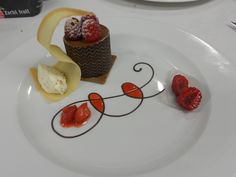 a white plate topped with desserts on top of a table