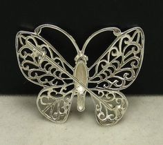 Sterling silver brooch - Butterfly, 925/1000. Stamped 925. Approximate weight 4.0 grams. Dimensions 3.5x2.9cm. All our jewels are made from solid sterling silver 925/1000 and are carefully crafted by hand in our family workshop. We dispatch your orders in 5 working days, worldwide and the postage is $5. We ship registered priority mail. Please allow 5-7 working days for delivery in Europe and 10-15 working days outside Europe. For any questions - please do not hesitate to contact me! Classic Silver Brooch, Sterling Silver Brooch Jewelry, Sterling Silver Pendant Brooch For Anniversary, Sterling Silver Pendant Brooch For Formal Occasions, Formal Sterling Silver Pendant Brooch, Sterling Silver Brooch In Silver, Sterling Silver Brooch Jewelry In Silver, Unique Sterling Silver Brooch In Silver, Silver Sterling Silver Pendant Brooches