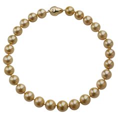 This contemporary necklace is composed of 27 natural color golden cultured South Sea Pearls measuring approximately 17.20 to 15.00mm. Completed by a baroque pearl form 14K gold clasp, the round golden pearls have a touch of rose colored orient. Unusual in their warm golden hue and large size, these lovely pearls are specially lustrous and appealing. Product Details: Item #: YN-21018 Country: United States Circa: Contemporary Dimensions: 19.00" length Materials: 14K Gold Signed: 585 Macklowe Gallery Curator's Notes: Golden cultured pearls of this size have a thick nacre, which enhances their rich luminescence and the crispness of their reflections. South Sea Pearl Necklace, Y 15, Contemporary Necklace, Gold Sign, Sea Pearl, Modern Necklaces, South Seas, South Sea Pearls, Sea Pearls