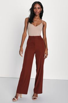 From work to happy hour, get down to business with the Lulus So Get This Rust Brown High-Waisted Wide-Leg Trouser Pants! Lightweight stretch-woven fabric shapes these pants with a high-rise waist, belt loops, and a hidden top clasp with a hidden zip fly. Two diagonal pockets accent wide pant legs that end at ankle-grazing hems. Fit: This garment fits true to size. Length: Ankle length. Size medium Inseam: 30.50 Front Rise: 13.00 Waist: Fitted - very fitted at natural waist. Hip: Loosely Fitted.