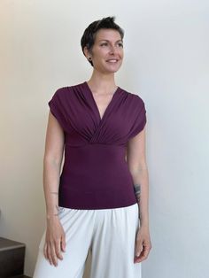 caraucci plant-based rayon stretch jersey purple cross over neckline top #color_jam Fitted Versatile Top For Yoga, Versatile Fitted Top For Yoga, Versatile Fitted Yoga Top, Versatile Yoga Tops For Spring, Versatile Spring Yoga Tops, Versatile Sleeveless Fitted Wrap Top, Versatile Fitted Sleeveless Wrap Top, Versatile Relaxed Fit Yoga Tops, Versatile Fitted Wrap Top With Short Sleeves