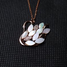 Swan Rhinestone Pendant & Necklace, New Trend Swan Opal Pendant Necklace with Long Chain, Elegant Swan Gold Plated Rhinestone Pendant & Necklace Stone Details → Shape: Round → Size: 1.00 ↣ Weight: 0.005 → Shape: Round → Size: 1.10 ↣ Weight: 0.006 → Shape: Round → Size: 1.30 ↣ Weight: 0.010 → Make: High Quality  ↣ Type: Moissanite ↣ Color: Colorless Handmade item Materials: Gold, Rose gold, White gold Chain style: Cable Style: Minimalist Jewelry style: Art deco Necklace length: Adjustable length Can be personalized Made to Order This jewelry set is available in silver, gold or pink gold(rose gold) color to match your dress Making Process: Handmade - Crafted by our experienced team The material used in these Necklace and earrings set are free from Lead, Nickel, Cadmium so it will not give yo Diamond Jeweled Necklace As A Gift, Elegant Jeweled Necklace For Anniversary, Luxury Jeweled Pendant Jewelry, Dazzling Jeweled Diamond Necklaces, Dazzling Diamond Jeweled Necklace, Elegant Diamond Jeweled Necklace, Luxury White Rhinestone Jewelry, Luxury Diamond Jeweled Necklaces, Luxury Diamond Jeweled Necklace