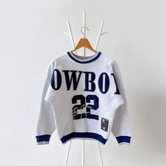 90s Dallas Cowboys NFL sweatshirt/ Kids * PLEASE READ BEFORE PURCHASE * PLEASE consider the PHOTOS before making the decision * The images may DIFFER in appearance from the actual product because we took pictures under daylight.  * PLEASE send your PHONE NUMBER after your purchase for the shipping company to contact you X No returns X No refund Condition : 9/10 More details : look at the pictures  Brand : Legends  Size :  Pit to pit/ Chests : 20/40 inches  Length : 23.5 inches  Material : cotton polyester  Color : gray * ALL ITEMS are VINTAGE which may show some signs of wear and tear * Due to the different display and different light, the picture may not reflect the actual color of the item * Please, remember that our items are vintage so they may show some signs of wear, tear and yellow Athleisure Outfits Casual, Personalised Fans, Dallas Cowboys Svg, Nfl Sweatshirt, Baby Jumpers, Bulldog Sweatshirt, Vintage Dallas Cowboys, Cowboys Svg, Hockey Sweatshirts