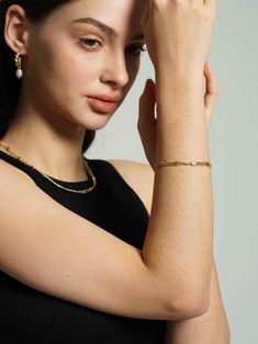 Enhance your bracelet collection with this striking 18K gold-plated layered chain bracelet, featuring rows of meticulously textured beads that offer a luxurious feel. A versatile addition for an effortlessly chic stacked look. Chic Yellow Gold Bracelet, Chic Yellow Gold Jubilee Bracelet, Gold Beaded Chain Bracelet In 14k Gold Filled, Chic Gold Plated Tarnish Resistant Bracelets, Elegant Multi-strand Gold Plated Jewelry, Gold Plated Jubilee Bracelet For Everyday Luxury, Tarnish Resistant Chain Bracelet For Layering, Gold Tarnish-resistant Bracelets For Layering, Chic Gold-plated Chain Bracelet