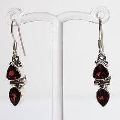 Make a statement with these elegant hand-crafted semi-precious stone earrings which feature red Garnet and rainbow Moonstone gemstones.  Stone: Garnet Colour: Red Metal: 925 Solid Sterling Silver  Drop Length: 3.5cm  Earring Width: 0.7cm Materials: Each one-of-a-kind piece of jewellery is lovingly hand crafted using top quality semi-precious natural gemstones and solid 925 sterling silver, so that you can treasure your piece for a lifetime.  Gift Boxes: each unique piece is also beautifully pack Red Gemstone Jewelry As Gift For Her, Red Gemstone Jewelry Gift For Her, Ruby Drop Earrings As A Gift, Silver Ruby Earrings With Birthstone, Nickel Free Ruby Earrings As A Gift, Nickel-free Ruby Earrings As A Gift, Nickel-free Ruby Earrings For Gift, Ruby Jewelry With Matching Earrings For Gift, Ruby Jewelry With Matching Earrings As A Gift