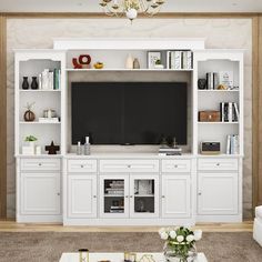 a living room with white furniture and a flat screen tv