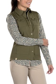 Woman Wearing SwingDish Amari Kaki Vest Product View 6 Utility Style Tops With Pockets For Outdoor, Utility Tops With Pockets For Outdoor, Utility Tops With Side Pockets For Outdoor, Khaki Sleeveless Nylon Vest, Khaki Nylon Vest, Functional Khaki Vest For Outdoor Work, Outdoor Khaki Vest With Functional Pockets, Functional Sleeveless Travel Vest, Khaki Outdoor Vest With Functional Pockets