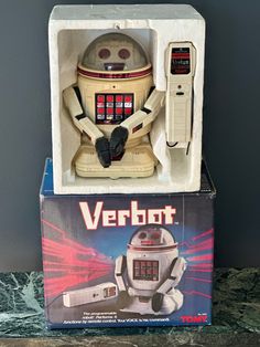 a toy robot sitting inside of a box