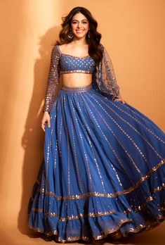 This set features a full sequin copper hand-embroidered lehenga with blouse and mirror border dupatta. Fabric: Dupatta - Net; Blouse - Georgette Color: Blue Care: Dry Clean Only About the Designer ... Modern Lehenga, Royal Blue Lehenga, Dull Blue, Lehenga With Blouse, Vani Vats, Mirror Border, Net Blouse, Simple Lehenga, Latest Bridal Lehenga