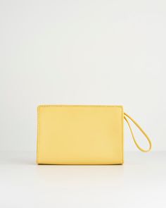 Like a little ray of sunshine, shining on your outfit, this wristlet pouch from our Meadow Creatures collection with its expertly crafted design comes in vibrant Sundress Yellow. Adding an instant pop of colour to any summer outfit, it’s a perfectly practical sized bag for all your everyday essentials. The chic, wrist handle allows hands free freedom, whilst Fable’s signature bee in gold-tone hardware adds a contemporary luxe finish.
  Key features:
  Approx. 19 (L) x 13 (H) x 6 (D) cm
 Outer: 1 Contemporary Luxe, Swan Jewelry, Luxury Christmas Gifts, Wristlet Pouch, Talisman Necklace, Ray Of Sunshine, Animal Brooch, Bottega Veneta Shoulder Bag, Louis Vuitton Shoulder Bag