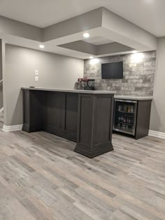 an empty basement with a bar in the middle