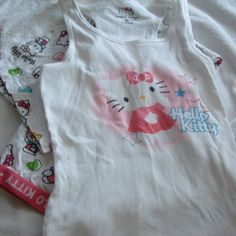 Hello Kitty Sanrio Pajamas 2 Piece Pajamas Set New Without Tags Size M Bottoms Waist Measures 14-14.5” Inches Lying Flat Not Stretched The Bottoms Are Cropped Measures 29”Inches From The Waist Band To The Bottom Hem Tank Top With Bottoms Wrinkles From Being Tucked Away In My Drawer. Never Worn From A Smoke Free Home Sanrio Pajamas, Hello Kitty Pajamas, Y2k Ideas, Mcbling Y2k, Sanrio Stuff, Hello Kitty Sanrio, Pajamas Set, Hair Clothes, Cute Fits