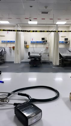 an empty hospital room with medical equipment on the floor